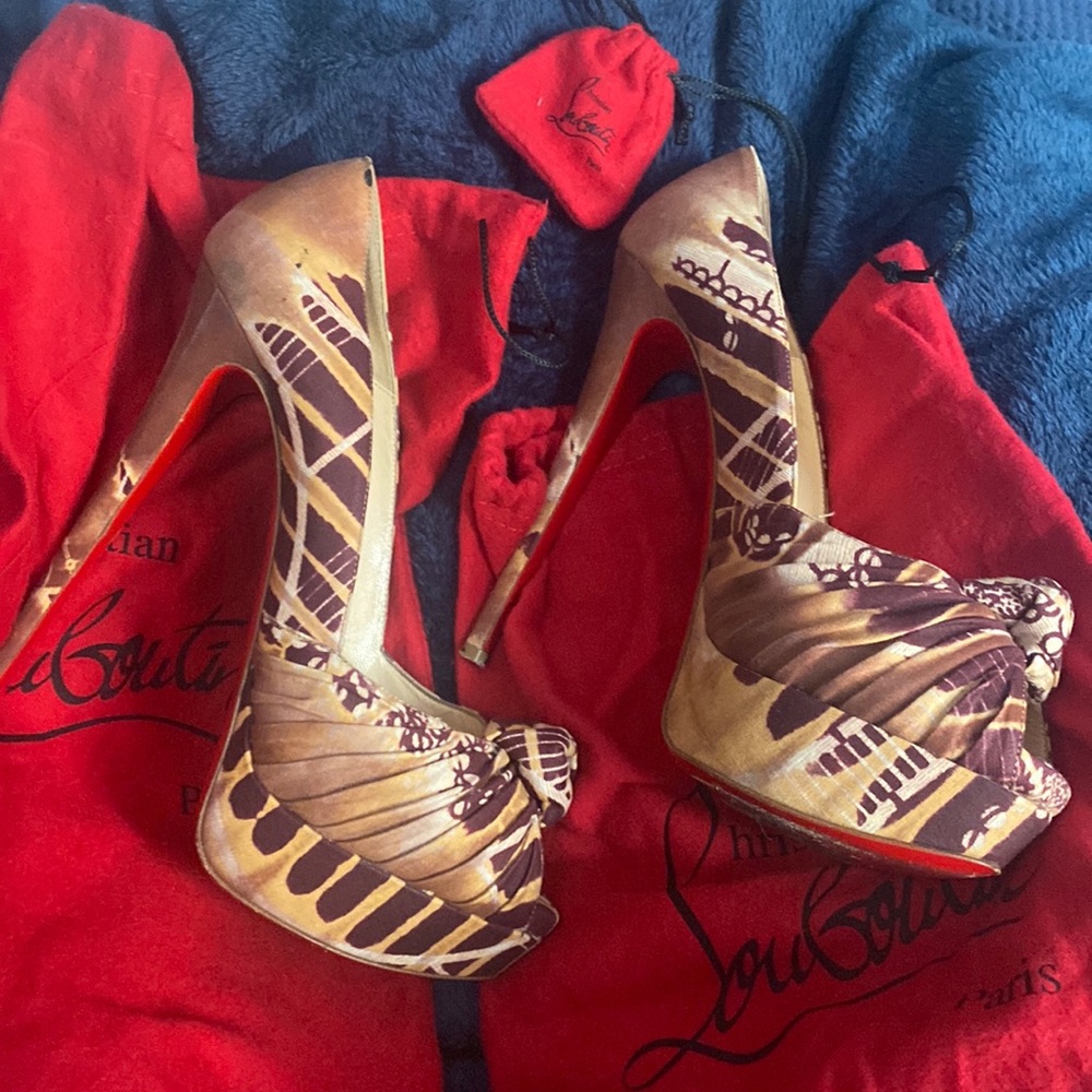 Gently worn red bottoms , tan and maroon color